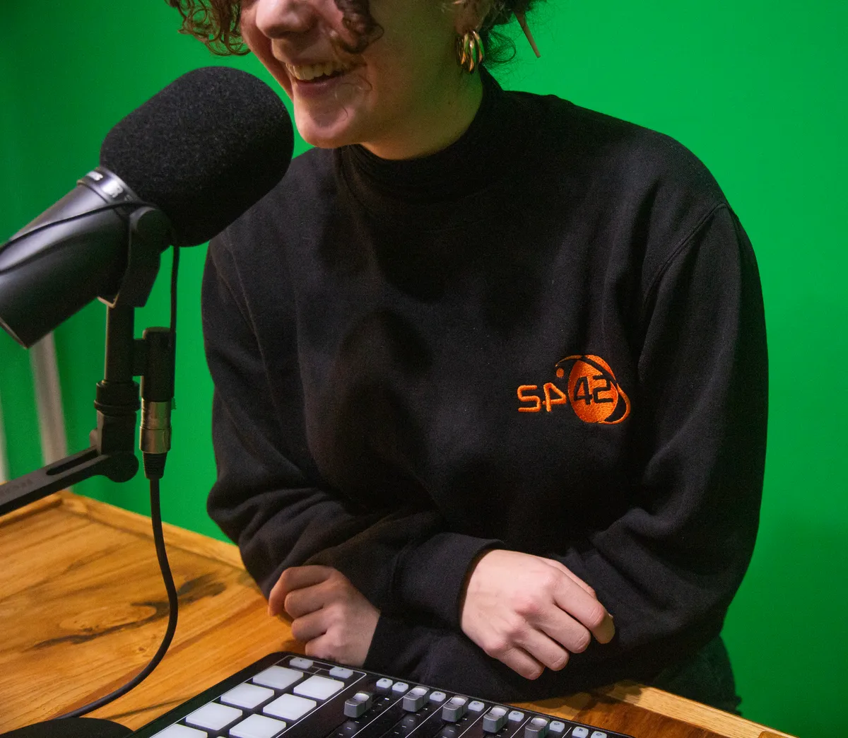 Space42 Green Room studio with presenter at broadcast desk